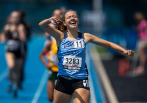 Downers Grove South's Michaela Hackbarth celebrates after winning the Class 3A 800m Run with a time of 2:11.24 during the IHSA Girls Track and Field State Finals at O'Brien Stadium, Saturday, May 23, 2015, in Charleston, Ill. Justin L. Fowler/The State Journal-Register